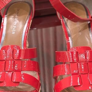 Red women’s sandals with wedge heel